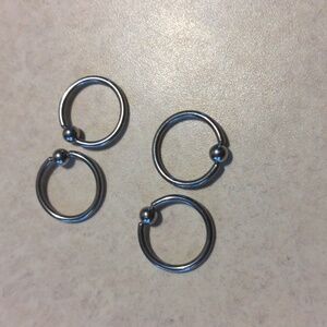 Set of four captive bead gauged earrings surgical steel unisex